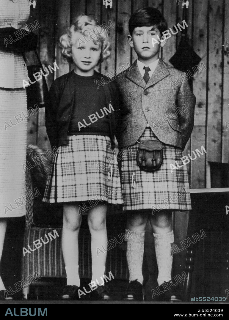 Britain's royal children, Princess Anne, left, and her brother, Prince Charles, dressed in appropriate kilts watch the Braemar games, in Scotland. September 09, 1955.