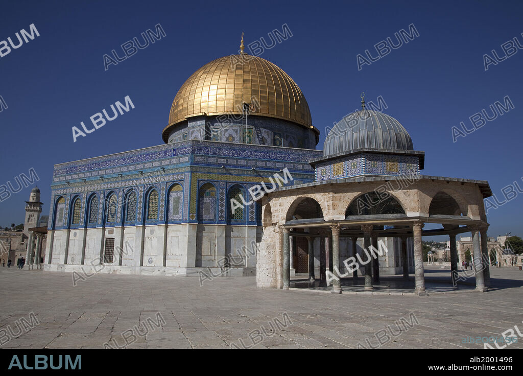 The Dome of the Rock is the oldest Islamic monument standing. It is a Muslim shrine that was built over a sacred stone, the "Foundation Stone". The stone is also the holiest site in Judaism, as well as a holy site in Islam. The edifice was built by Umayyad caliph Abd al-Malik from 688 to 691 AD. The exterior mosaic were repaired in the Mamluk period, and then completely replaced in 1545 by Sulieman the Magnificent. At the same time the parapet wall with its inscription was built. The tiling was replaced again in 1956-62. The aluminum dome is covered with gold leaf. The Dome of the Chain is a free-standing dome located immediately to the east of the Dome of the Rock, on the Temple Mount in Jerusalem. Located at the exact center of the sanctuary, it is one of the oldest structures in the compound. It was either built by the Umayyad caliph Abd al-Malik in 691, like the Dome of the Rock, or prior to the Islamic rule in Jerusalem. The structure is of a domed hexagon with open arches surrounded by an eleven-sided polygon with eleven open arches. The Old City of Jerusalem and its Walls were declared a World Heritage site by UNESCO in 1981.