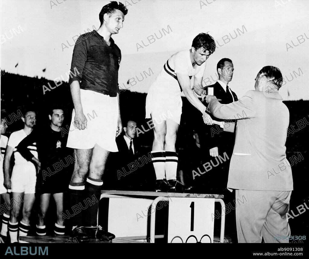 Finland,Helsinki/ Olympics,1952: The Olympic Football final was won by Hungary (in white), who defeated Yugoslavia by 2-0. Sweden got the bronze medal. Erich Frenckell, President of the Olympic Organising Committee, makes the presentation.