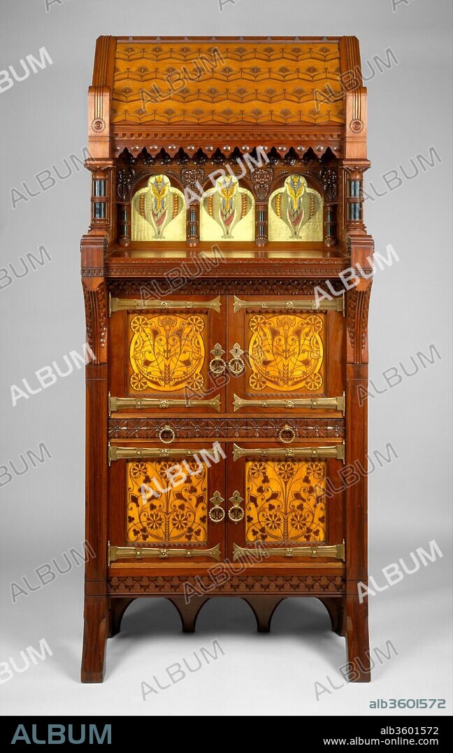 Cabinet. Culture: American. Dimensions: 96 x 42 x 20 in. (243.8 x 106.7 x 50.8 cm). Maker: Attributed to Daniel Pabst (1826-1910). Date: ca. 1877-80.
This Modern Gothic cabinet superbly demonstrates the influence of British reform theory on American design in the late nineteenth century. In form and decoration, it is indebted to the British architect Bruce J. Talbert, whose book "Gothic Forms Applied to  Furniture, Metal Work, and Decoration for Domestic Purposes" (Birmingham, 1867; Boston, 1873) was influential in this country. A kinship with the work of the Philadelphia architect Frank Furness is also evident in the overall form of the cabinet, the verticality and shingled "roof" of which somewhat resemble Furness's bank buildings of the 1870s. The reverse-painted ribbed-glass panels are of a type Furness began to use on buildings as architectural decoration in 1876. Their stylized floral motif recalls the geometric plant forms of Christopher Dresser, a leading English ornamentist of the period who visited the Centennial Exhibition in Philadelphia in 1876 and whose published  designs were well known in this country. Daniel Pabst, a leading manufacturer of artistic furniture in Philadelphia, probably executed the cabinet. A related cabinet, now in the Brooklyn Museum of Art, is documented to Pabst.