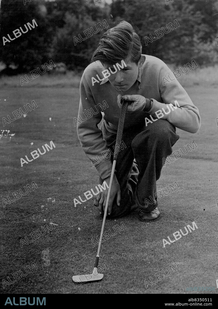 At practice at Redhill is 15-year-old. George Johns, the youngest-ever golfer to reach the last l6 in the "Evening News" Week-end Tournament. George, a Redhill and Reigate schoolboy, plays his next tournament match at Romford on September 8. 
At practice at Redhill, England, is 15-year-old George Johns, youngest golfer ever to reach the last 16 in the Evening News Weekend Tournament. He plays his next match on Wednesday. August 24, 1954. (Photo by Daily Mail Contract Picture).