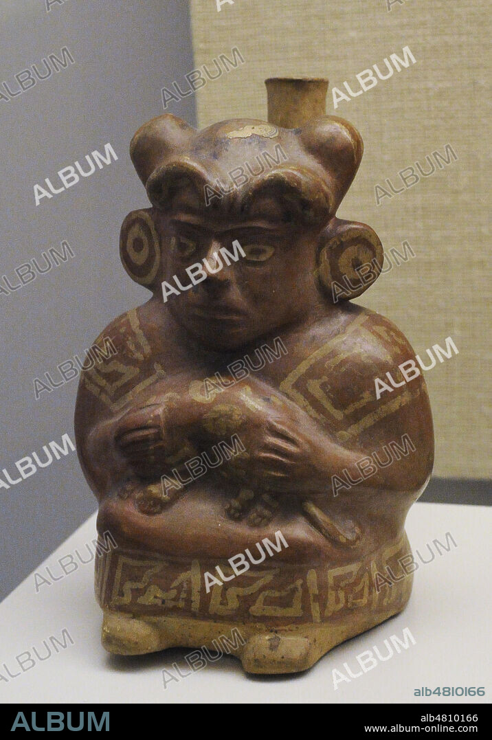 Vessel representing a person dressed in a shirt. Ceramics. Moche