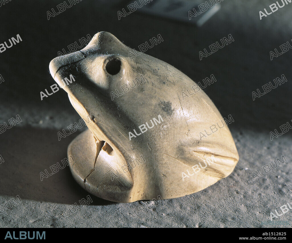 Egyptian civilization, Predynastic Period, circa 3100 b.C. Ivory statuette of zoomorphic deity: the frog was associated to the goddess of childbirth Heqet, among others. Height 2.7 cm.