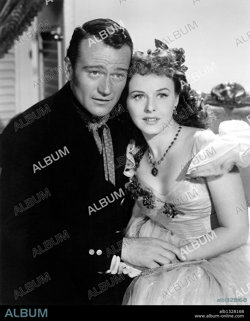JOHN WAYNE and PAULETTE GODDARD in REAP THE WILD WIND, 1942, directed by  CECIL B DEMILLE. Copyright PARAMOUNT PICTURES. - Album alb1328168