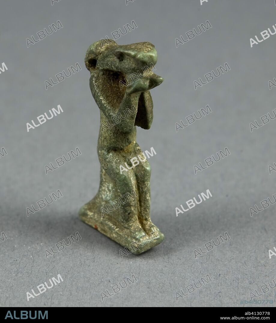 ANCIENT EGYPTIAN. Amulet of the God Nehebkau. Egyptian. Date: 1070 BC-656 BC. Dimensions: 3.8 × 1.9 × 0.6 cm (1 1/2 × 3/4 × 1/4 in.). Faience. Origin: Egypt.