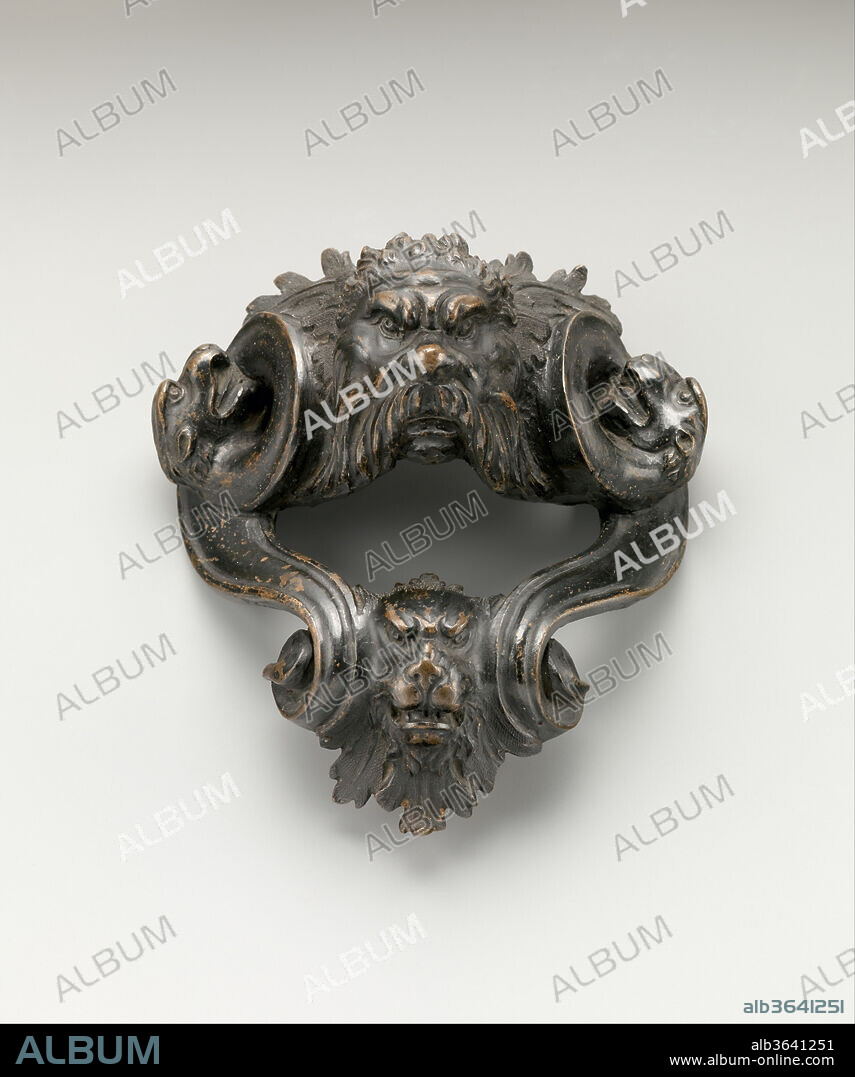 Mount with grotesque masks. Culture: Italian, probably Florence. Dimensions: Overall (confirmed): 6 1/16 × 5 1/2 × 3 1/4 in. (15.4 × 14 × 8.3 cm). Date: mid-17th century.
This mount may have formed a handle for a vase.