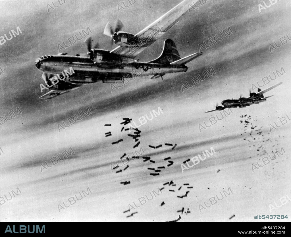 Superfortress Bombs Over Burma. Tons of bombs speckle the sky over Rangoon, Burma, as they spew from the yawning bomb bays of B-29 Superfortresses. The target of this daylight attack by the 20th Bomber Command B-29s was a large Japanese supply depot near the Mingaladon Air Field near Rangoon. January 3, 1945. (Photo by Associated Press Photo).