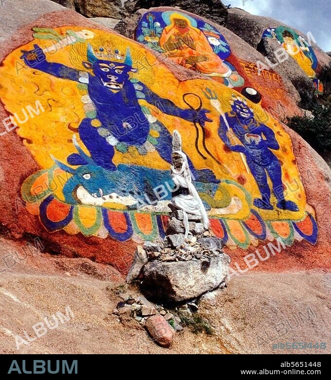 Lhasa (Tibet), rock painting on the tower opposite Potala Palace. Depiction of Yamantaka, the wrathful form of Bodhisattva Manjushri (bottom) and Tsongkhapa, founder of the Gelugpa School (top). Photo, undated.