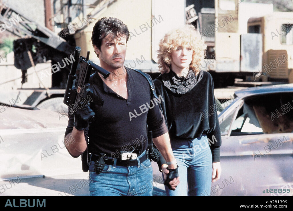 BRIGITTE NIELSEN and SYLVESTER STALLONE in COBRA, 1986, directed by GEORGE P. COSMATOS. Copyright WARNER BROTHERS.