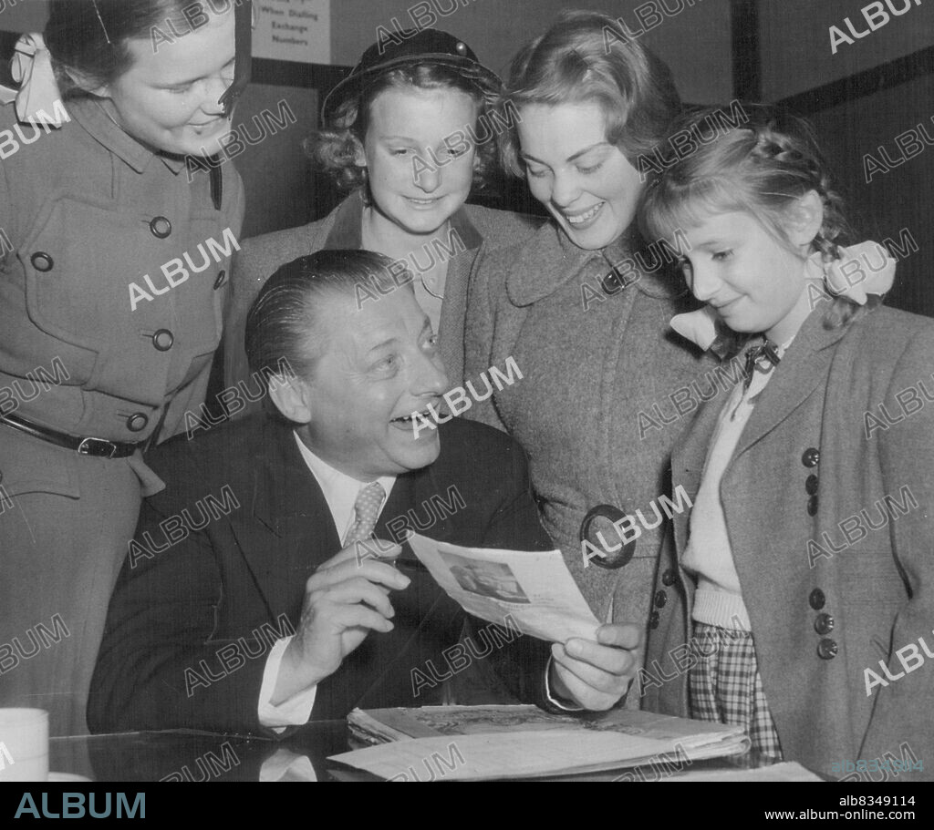 Dr. Hans Schmidt-Isserstedt, visiting German conductor, explains the pronunciation of his name to four eager photograph hunters after a concert at the Town Hall this afternoon.
The girls are left to right : Julia Ryan, 14 years of Gordon., Margaret Chambers, 12 years of Hurstville, Janet Harvey, 15 years of Lane Cove, Rosemary Chambers, 8 years of Hurstville.
This was the Doctor's farewell concert, he leaves tomorrow for Adelaide. August 09, 1953. (Photo by Stuart William MacGladrie/Fairfax Media).