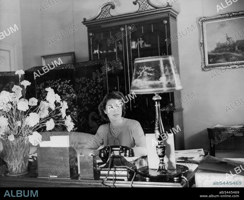 The Queen at her desk in Buckingham Palace. June 16, 1952.