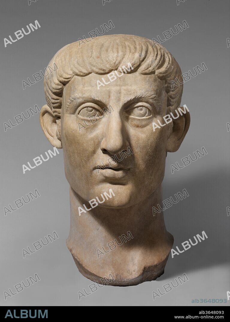 Marble portrait head of the Emperor Constantine I. Culture: Roman. Dimensions: 37 1/2 × 23 × 26 1/2 in., 1100 lb. (95.3 × 58.4 × 67.3 cm, 499 kg). Date: ca. A.D. 325-370.
Constantine the Great was the first Christian emperor of Rome, and his reign had a profound effect on the subsequent development of the Roman, later Byzantine, world. By 325 he had succeeded in reunifying the empire, having defeated the last of his former tetrarchic colleagues, the eastern emperor Licinius. He thereafter aimed to establish a new dynasty and to found a new capital, named Constantinople after himself. Christianity played an important role not only in Constantine's personal life and success, but also in the program of reform and renewal that he had planned for the Roman Empire.
Although the court and administration no longer resided at Rome, Constantine was careful not to neglect the old imperial city and adorned it with many new secular and Christian buildings. The most famous of these is the triumphal arch, the Arch of Constantine, which still stands near the Colosseum. Similarly, the fragments of a colossal statue that now adorn the courtyard of the Museo del Palazzo dei Conservatori in Rome, probably once stood in imposing grandeur in the main hall of the Basilica of Maxentius, a building that was completed by Constantine. Both of these works contain re-used material from earlier monuments, a practice that was not only economical but probably was also intended to shed reflected glory of the emperor by associating his reign in a very direct and practical way with that of famous "good" emperors from the past. The long face, neatly arranged hairstyle, and the clean-shaven appearance of this portrait head are a deliberate attempt to evoke memories of earlier rulers such as Trajan, who in the later third and fourth centuries was seen as an ideal example of a Roman emperor. Certainly, by the time that the head was set up, as part of either a bust or, more probably, an over life-sized statue, Constantine had adopted an official image that was intended to set him apart from his immediate predecessors.