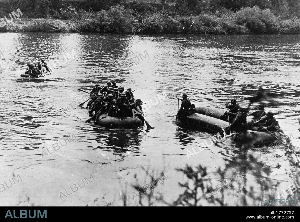 German soldiers crossing the Berezina River. Detachments of the German army crossing the Berezina River aboard inflatable dinghies. Belarus, July 1941.