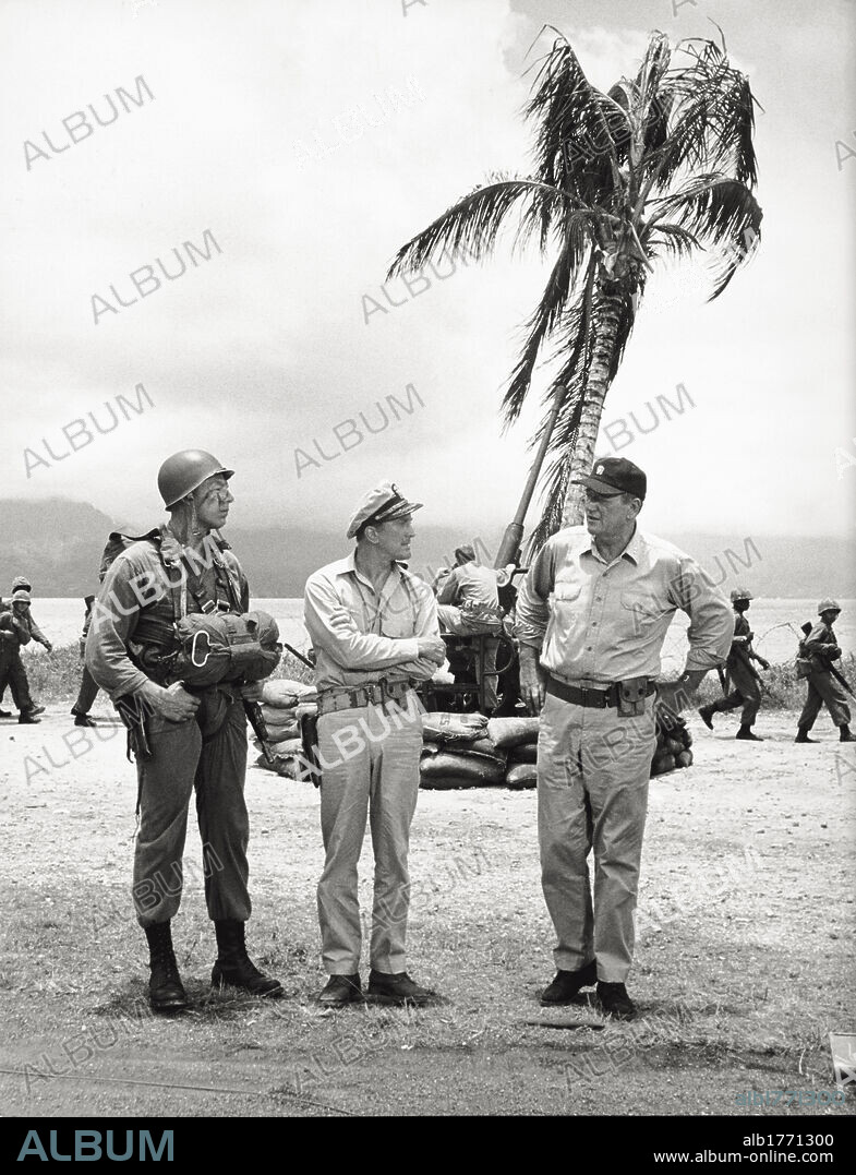 Kirk Douglas and John Wayne in a scene of 'In Harm's Way'. The US actors Kirk Douglas (in the centre) and John Wayne (on the right) in a scene of the war movie 'In Harm's Way', on the following phases of the attack on Pearl Harbour. Hawaii (United States), 1965.