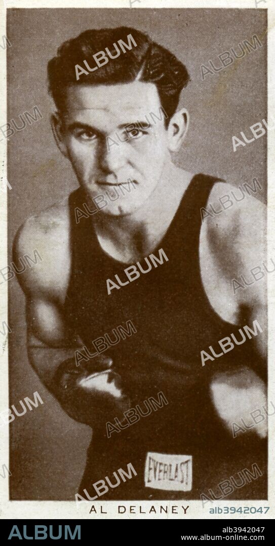 Al Delaney, Canadian boxer, 1938. Born Alex Borchuk, Delaney (1916-1997) fought at heavyweight. His career included 102 fights, with 64 wins, 31 losses and 7 draws. He won the Canadian heavyweight title in 1941. A Churchman's Cigarettes picture card.