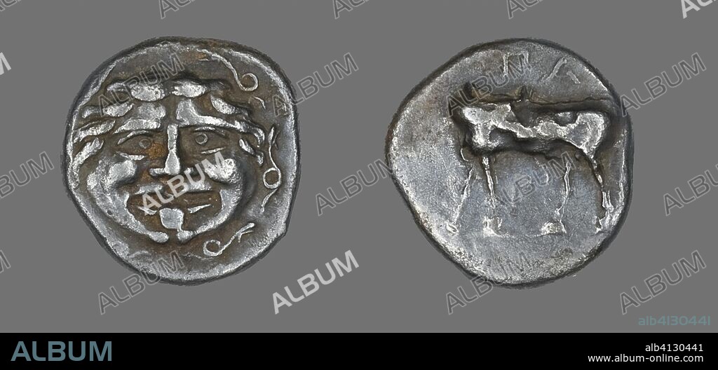 ANCIENT GREEK. Hemidrachm (Coin) Depicting a Gorgoneion. Greek, minted in Parium, Mysia. Date: 400 BC. Dimensions: Diam. 1.4 cm; 2.28 g. Silver. Origin: Ancient Greece.