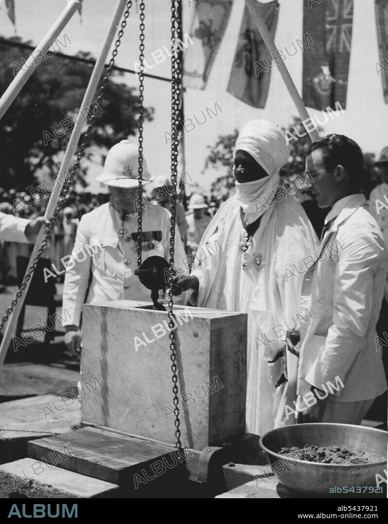 Introducing West Africa -- The Sultan of Sokoto one of the native Empire in ia, rules within the framework of the British Constitution. Here he lays a foundation stone. September 11, 1951. (Photo by British Official Photograph).;Introducing West Africa -- The Sultan of Sokoto one of the native Empire in ia, rules within the framework of the British Constitution. Here he lays a foundation stone.