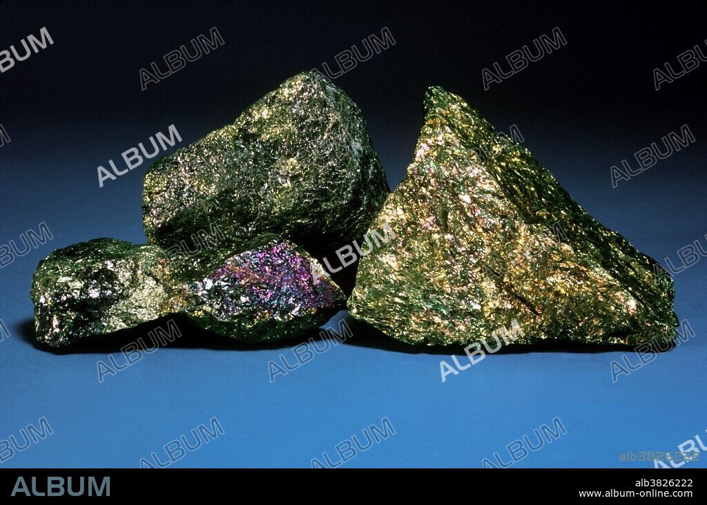 Bornite, copper iron sulfide, is an important ore of copper, and occurs in mines throughout the world. It is a shiny metallic bronze-colored mineral that quickly tarnishes in air to form a characteristic iridescent coating. Mines at Butte, Montana are well known occurrences of bornite.