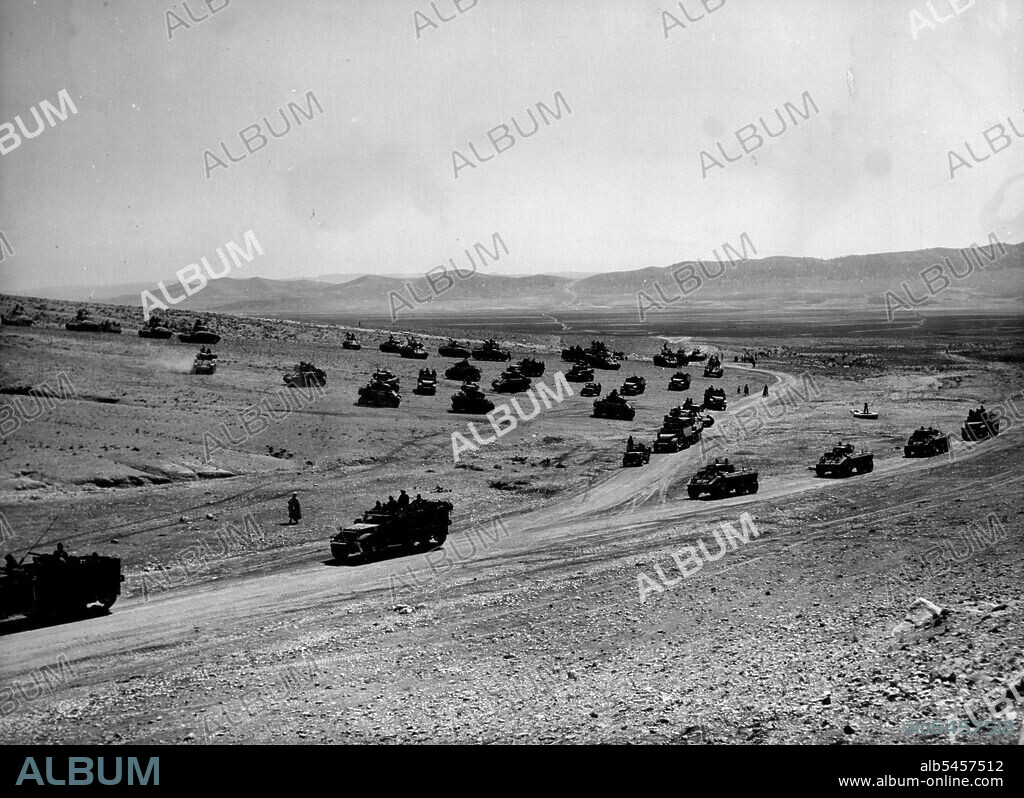 French War Games in Algeria --The Equipment shown here is American; much of it saw Service during the War.
Sweeping across the sands of Algeria, French motorised Units maneuver near Tebessa. The French War Games there ended September 11. September 27, 1951. (Photo by Associated Press Photo).