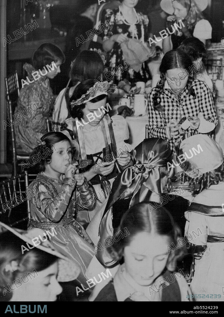 Princess Margaret Blows a "Squeaker" Attends Fancy Dress Party with Sister - Princess Margaret Rose blows a "squeaker" at the party.
Background (left) is Princess Elizabeth.
Princess Elizabeth and Princess Margaret Rose attended a children's fancy party at the home of Viscountess Astor in St. James' Square, London.
Both the Princess were historical costumes of the Elizabeth an period.
They mixed freely with the 70 other young guests, who included the children of the American Ambassador, inflated balloons, joined in the games and amused themselves enormously. March 07, 1939.