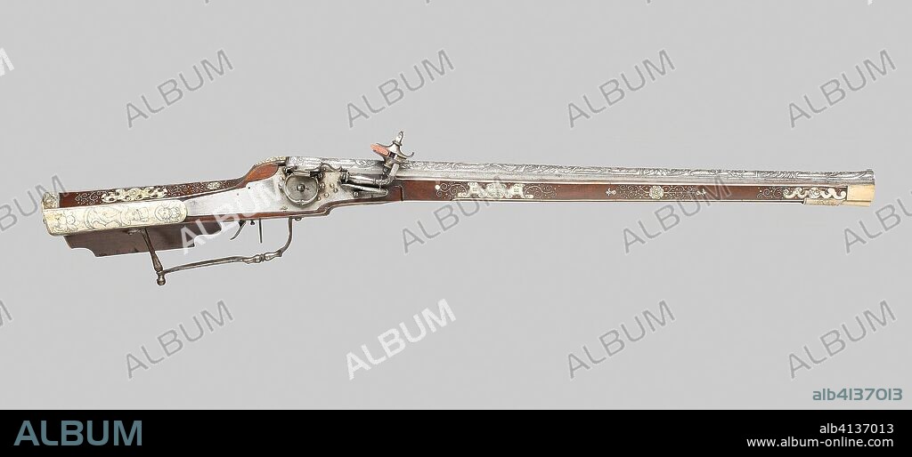 Wheellock Rifle. German and Italian. Date: 1580. Dimensions: L. 81.3 cm (32 in.)
Barrel L. 57.2 cm (22 1/2 in.)
Caliber .58
Wt. 4 lb. Walnut stock with horn inlay. Origin: Germany.