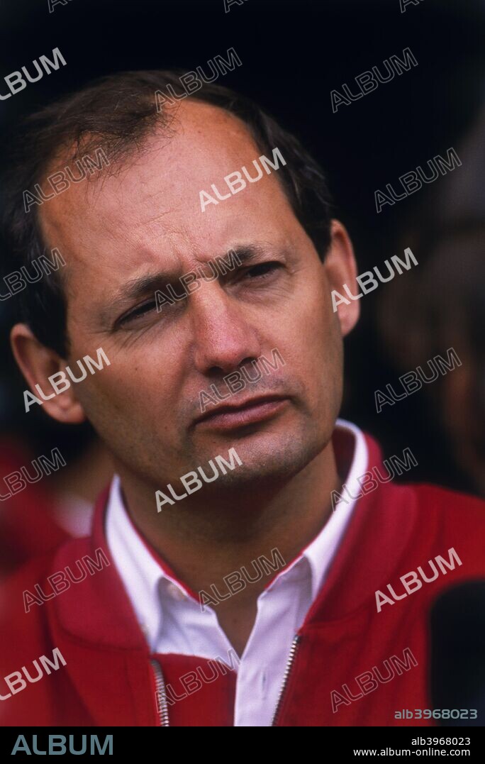 Ron Dennis, McLaren Formula 1 team manager, British Grand Prix, Silverstone, Northamptonshire, 1989. After working for various Formula 1 teams as a mechanic in the 1960s, Ron Dennis switched to team management in the 1970s. In 1980, Malboro engineered the merger of the McLaren racing team with Dennis' Project Four team to create McLaren International, and in 1981, Dennis took over the running of the entire operation. The team went on to become one of the most dominant outfits in Formula 1 history, winning the World Drivers' Championship in 1984, 1985, 1986, 1988,1989, 1990 and 1991 and the Constructors' Championship in the same years apart from 1986. A lean period followed, but McLaren came back to the fore in the late 1990s, with Mika Hakkinen winning the Drivers' crown in 1998 and 1999 with the Constructors' Championship being won in 1998 as well.