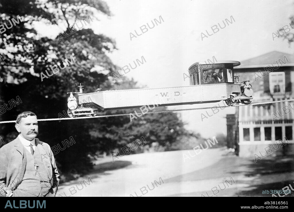 Brennan and his gyroscope railroad, New York, no date given. Louis Brennan (January 28, 1852 - January17, 1932) was an Irish-Australian mechanical engineer and inventor. Brennan invented the idea of a steerable torpedo in 1874, from observing that if a thread is pulled on a reel at an angle with suitable leverage, the reel will move away from the thread side. Brennan went to England in 1880 and brought his invention before the War Office. In 1887 Brennan was appointed superintendent of the Brennan torpedo factory, and was consulting engineer 1896-1907. He did much work on a monorail locomotive which was kept upright by a gyrostat. In 1903 he patented a gyroscopically-balanced monorail system that he designed for military use. From 1916 to 1919 Brennan served in the munitions inventions department. From 1919 to 1926 he was engaged by the air ministry in aircraft research work at the Royal Aircraft Establishment and gave much time to the invention of a helicopter. The government spent a large sum of money on it, but in 1926 the air ministry gave up working on it. In January 1932 he was knocked down by a car in Switzerland, and died several days later at the age of 79.