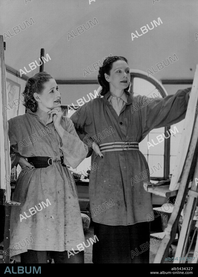 Anna And Doris Zinkeisen -- Photograph of the famous artist sisters in the studio of Anna Zinkeisen who is seen on left. March 06, 1951. (Photo by Tom Blau, Camera Press).