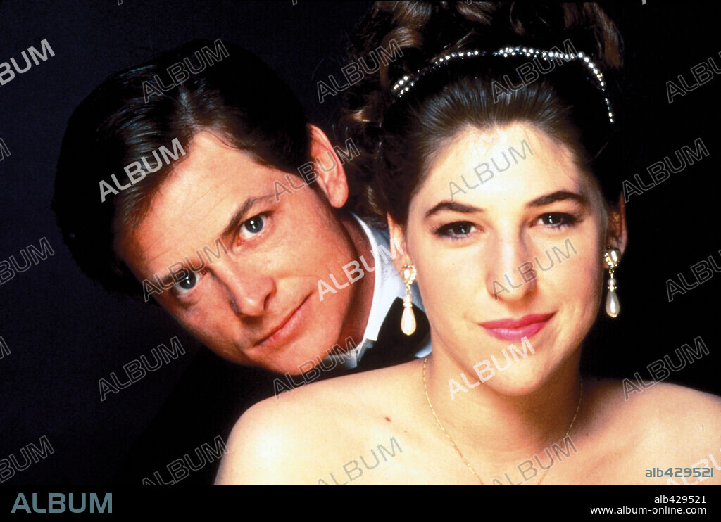 MAYIM BIALIK and MICHAEL J. FOX in DON'T DRINK THE WATER, 1994, directed by WOODY ALLEN. Copyright BUENA VISTA HOME VIEDO.