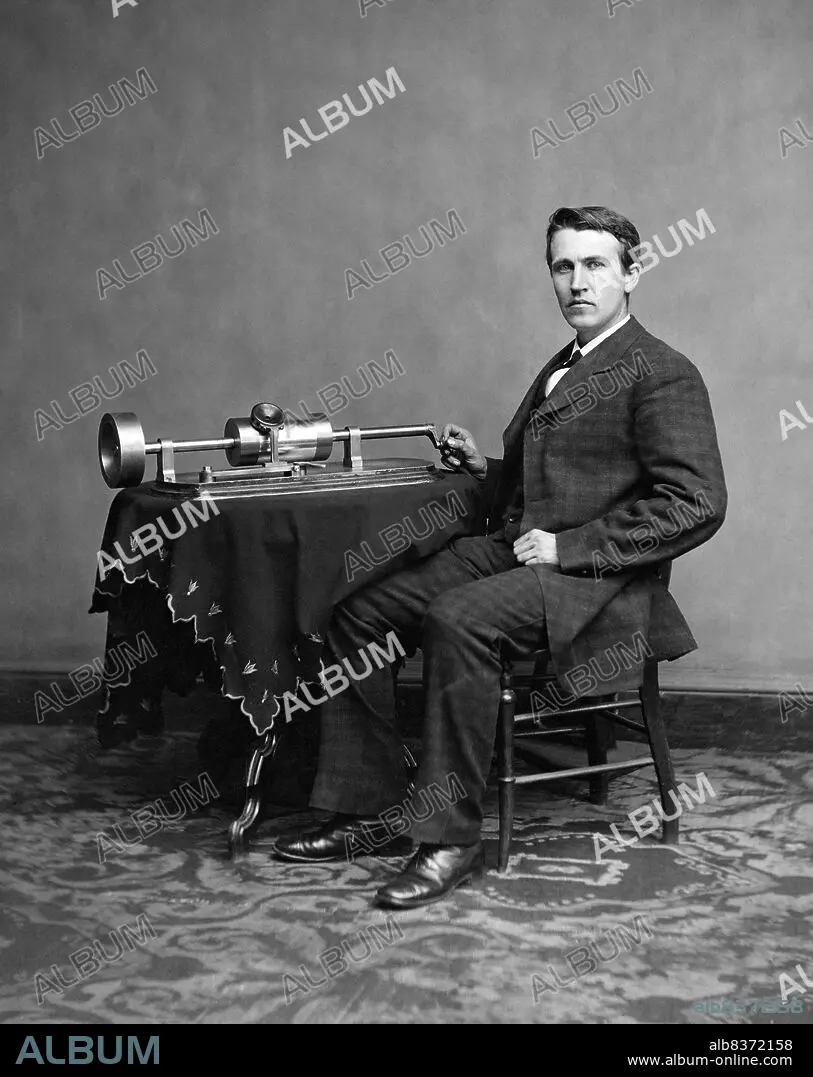 USA: American inventor and businessman Thomas Edison (1847-1931) with his  early phonograph, c. 1878 - Album alb8372158