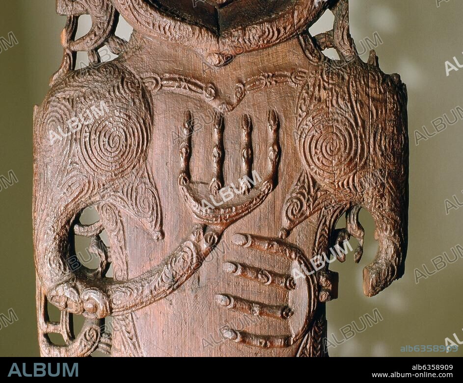 Wall slab from the house of Hinematioro, a chieftainess of the Ngati Porou tribe. The small figure between the legs of the female ancestor depicted acknowledges her role as the source of future generations. Country of Origin: New Zealand. Culture: Maori. Date/Period: 18th C. Place of Origin: Whangara. Material Size: Wood.