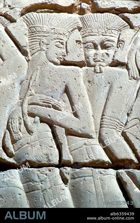 3545. PHILISTINE SOLDIERS WEARING THE TYPICAL PHILISTINE HEADDRESS. RELIEF FROM THE GREAT TEMPLE OF MEDINET HABU DEPICTING THE BATTLES OF RAMSES III. (1195-1164 B.C.).