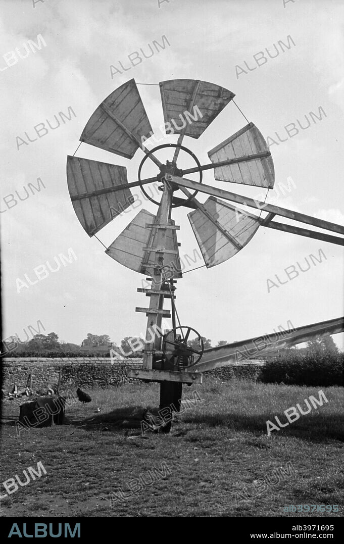 Fan staging on a windmill at Tottenhill in Norfolk, 1936. The fantail is a device for rotating the mill in order to keep the sails facing the wind at all times. This type of fan carriage was traditional in Suffolk, but also used on some Norfolk mills.
