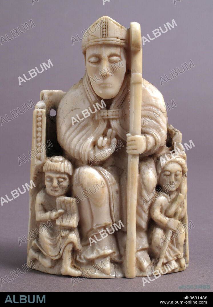 Bishop Chess Piece. Culture: Scandinavian. Dimensions: Overall: 3 3/4 x 2 1/2 x 1 7/16 in. (9.6 x 6.3 x 3.6 cm). Date: 1150-1200.
The Bishop was introduced to the European chessboard in the 12th century, replacing the elephant of Islamic tradition. The substitution of a man of the church for an animal used in battle may seem curious, but medieval bishops frequently served with armies. That role is not on display here: the smaller figures probably represent men who served the Bishop in ceremony. An official known as a Reader holds the Bishop's book. He has been tonsured--his hair shaven in a circle at the crown of his head. The man holding a staff and cradling his ear may be the Precentor, who was in charge of the choir.