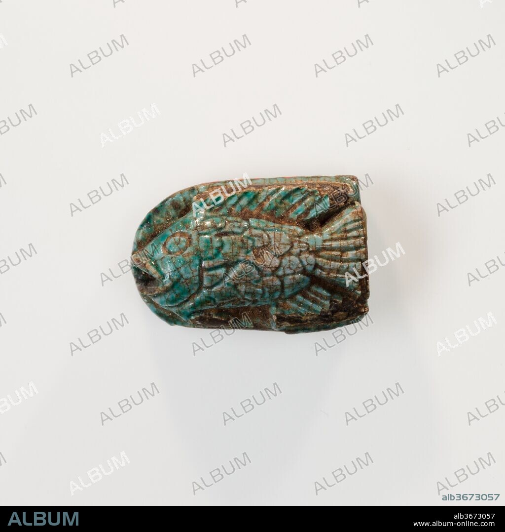 Fish Design Amulet Inscribed with the cartouche of Queen Ahmose Nefertari. Dimensions: L. 1.5 cm (9/16 in); W. 1 cm (3/8 in); Th. 0.6 cm (1/4 in). Dynasty: Dynasty 18, early. Reign: reign of Ahmose I-Thutmose II. Date: ca. 1550-1479 B.C..
The inscription on the base of the amulet reads "Nefertari" and may refer to Ahmose-Nefertari, the wife of King Ahmose I and the mother of Amenhotep I. She was held in high regard throughout the New Kingdom.