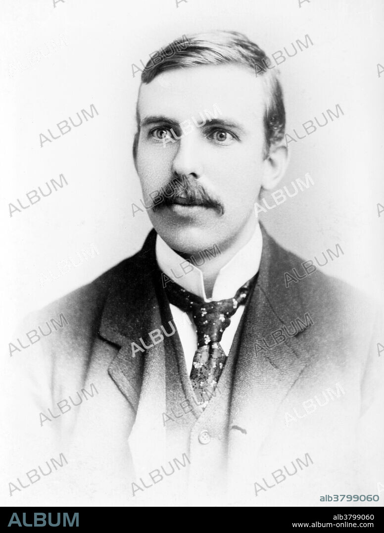 Ernest Rutherford (August 30, 1871 - October 19, 1937) was a New Zealand-born British chemist and physicist who became known as the father of nuclear physics. He discovered the concept of radioactive half-life, proved that radioactivity involved the transmutation of one chemical element to another, and also differentiated and named alpha and beta radiation, proving that the former was essentially helium ions. This work was done at McGill University in Canada. It is the basis for the Nobel Prize in Chemistry he was awarded in 1908. In 1911, he theorized that atoms have their positive charge concentrated in a very small nucleus, and thereby pioneered the Rutherford model of the atom, through his discovery and interpretation of Rutherford scattering in his gold foil experiment. He is widely credited with first "splitting the atom" in 1917 in a nuclear reaction between nitrogen and alpha particles, in which he also discovered (and named) the proton. After his death in 1937, he was honored by being interred with the greatest scientists of the United Kingdom, near Sir Isaac Newton's tomb in Westminster Abbey. The chemical element rutherfordium (element 104) was named after him.