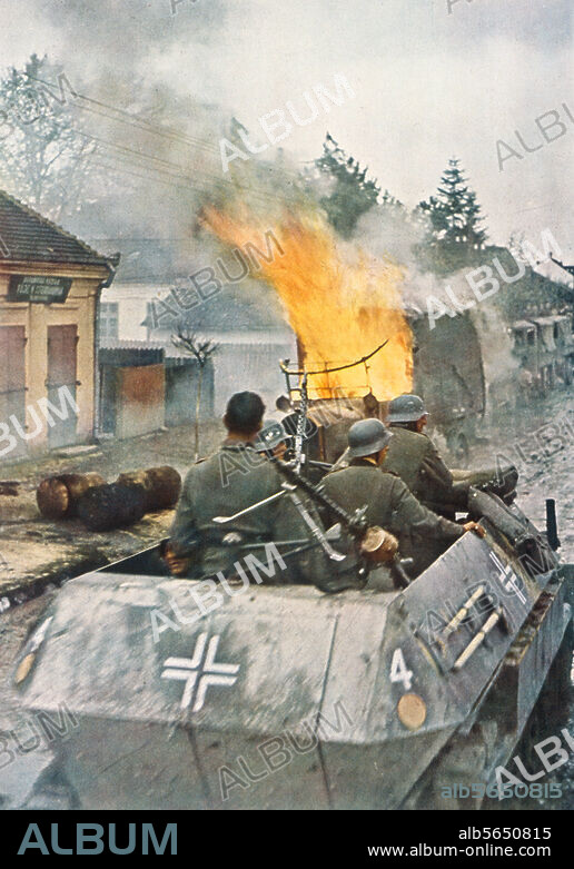 History / WW2 / Eastern Front:. "On the route of the advance in the East, German tanks have set a enemy truck ablaze.". (The 7th Armored Division - by the French soldiers it was called "Ghost Division" (La division fantome) - passes the Serbian city of Nis on the route of the advance to Belgrade). PK-photo, colored, period of the advance April 6-17, 1941, by Arthur Grimm (1908- after 1990). From: Magazine "die neue linie", August 1941, S. 8.