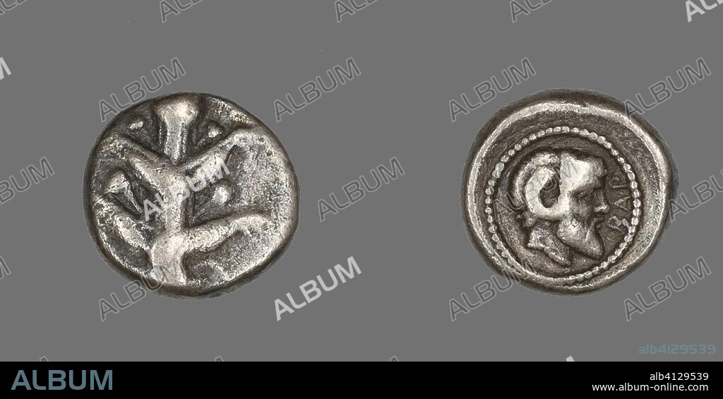 ANCIENT GREEK. Coin Depicting Silphium Plant. Greek. Date: 480 BC-435 BC. Dimensions: Diam. 1.4 cm; 3.19 g. Silver. Origin: Barce.