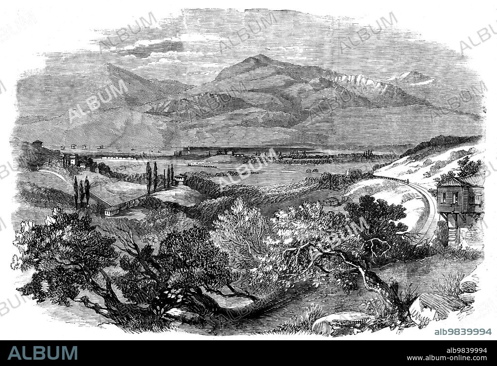 The Smyrna and Aïdin Railway, 1858. 'This railway being the first and only undertaking of the kind in the Ottoman Empire derives from that circumstance alone an interest of more than ordinary significance...it will open a rich district to the south-east of Smyrna, and will connect the town of Aïdin with that port by a line of upwards of seventy miles in length. Some idea may be formed of the enormous amount of traffic from the fact that during the busy months more than 5000 camels arrive daily at Smyrna, laden with the various products of the district through which this line passes, and which will, of course, be imported by the new mode of conveyance...The line is just completed to the village of Sedikoi, ten miles from Smyrna. The Illustration is taken from the old Boudjah road. In the valley below is seen the River Meles...The hill on the left is the foot of Mount Pegus; in the middle distance is the Caravan-bridge Hotel, and where will be the first station of the railway; beyond is seen the inner bay of Smyrna, with its blue waters, on which the spirit of innovation constantly glides in the form of a twopenny steamer, of unmistakable Thames build, for the convenience of the opposite village of Bornabat. The distant mountain is Sypilus...'. From "Illustrated London News", 1858.