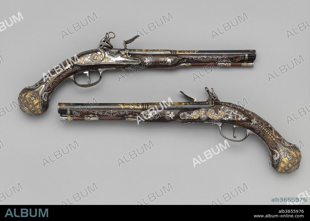 Pair of Flintlock Pistols Made for Ferdinand IV, King of Naples and Sicily (1751-1825). Barrelsmith: Emanuel Esteva (Spanish, active in Naples, Italy, recorded about 1768-73). Culture: Italo-Spanish, Naples. Dimensions: L. of each 17 3/8 in. (44.1 cm); L. of each barrel 11 1/16 in. (28.1 cm); Cal. .63 in. (16.0 mm); Wt. of each 2 lb. 4 oz. (1021 g). Gunsmith: Michele Battista (Spanish, active in Naples, Italy, recorded about 1760-90). Manufacturer: Royal Arms Manufactory at Torre Annunziata (Italian, Naples, established 1757). Date: ca. 1768.
The Royal Arms Factory in Naples was established in 1757 with the significant participation of Spanish gunmakers, who strongly influenced Neopolitan arms production in both technical innovations and artistic style. These magnificent pistols are signed by two leading craftsmen of the factory and appear to have been made for their patron, King Ferdinand IV of Naples and Sicily (1751-1825). What may be portraits of the young king and his queen on the butts of the pistols suggests that they were made to commemorate the royal wedding in 1768.