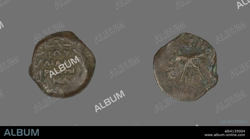 ANCIENT ROMAN. Coin Depicting a Wreath and Palm Branches. Roman, minted in Jerusalem (?). Date: 54 AD-55 AD. Dimensions: Diam. 1.7 cm; 2.45 g. Bronze. Origin: Roman Empire.