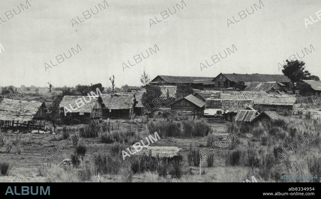 Ruins of Camp O'Donnell Barracks -- This is a view of the Barracks at Camp O'Donnell, on Luzon, after it was captured by American troops. Afilipino colonel who survived O'Donnell estimated 40,000 American and Filipino soldiers -- half of the 80,000 who were imprisoned there after the infamous "Death March" of Bataan -- had died of disease, malnutrition and mistreatment. Filipino survivors were released and American survivors were moved by the Japanese some time before the American occupation. This, and other pictures in this series, were made by Carl Mydans, Life Photographer on assignment with the wartime still picture pool. Mydans was among those taken prisoner when the Philippines fell, and was later repatriated. July 02, 1945. (Photo by Carl Mydans, Associated Press Photo).