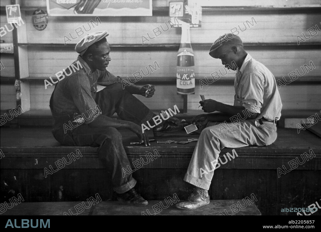 African American Playing cards on a bench.