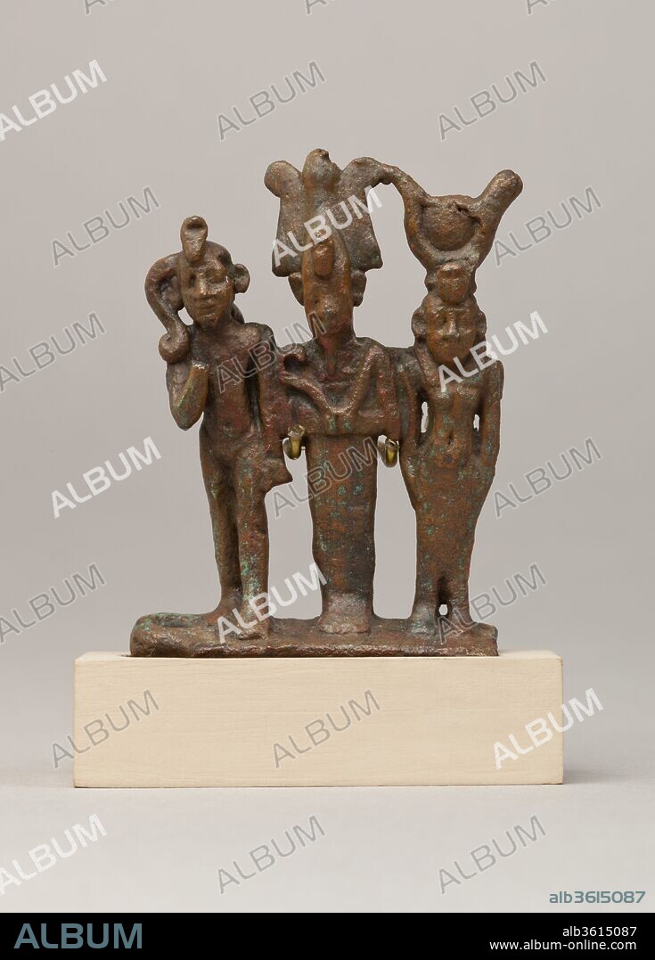 Isis, Osiris and Horus triad. Dimensions: H. 7 cm (2 3/4 in.); W. 5.5 cm (2 3/16 in.); D. 2.1 cm (13/16 in.). Date: 664-30 B.C..