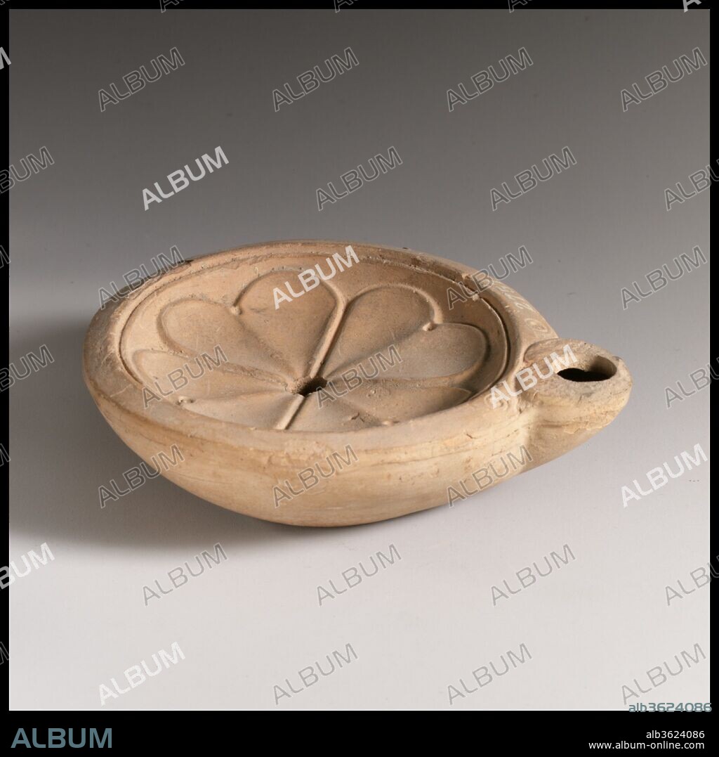 Terracotta oil lamp. Culture: Roman. Dimensions: Length: 3 7/8 in. (9.9 cm)
Height: 1 3/16 in. (3 cm). Date: 2nd century A.D..