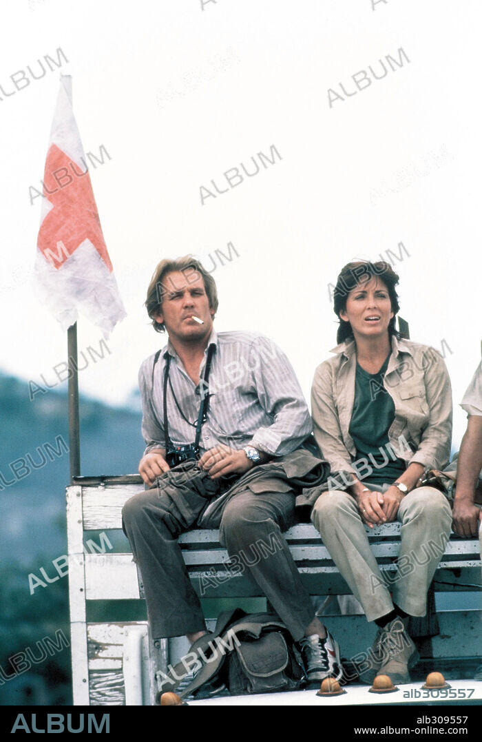 JOANNA CASSIDY and NICK NOLTE in UNDER FIRE, 1983, directed by ROGER SPOTTISWOODE. Copyright ORION PICTURES.