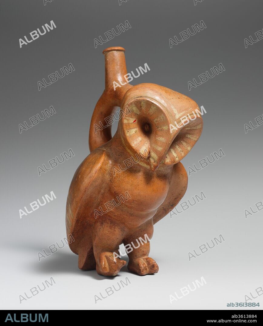 Owl Stirrup Spout Bottle. Culture: Moche. Dimensions: H. 9 1/2  x  W. 4 5/8in. (24.1 x 11.7cm). Date: 2nd-3rd century.
Moche ceramists rendered naturalistic details of humans, animals, and plants with great anatomical precision. Exact species and even historical individuals can be recognized in sculptural images depicted with a high degree of realism. In Moche religion and iconography, birds of prey include falcons, eagles, condors, vultures, and owls. Naturalistic or anthropomorphized birds of prey perform a variety of ritual activities related to their natural behavior such as battles, hunts, and sacrifices. Perhaps because they are nocturnal, owls seem to be closely related to the funerary domain. Anthropomorphized owls prepare bodies and offerings for burials and also carry deceased warriors to the world of the dead. Many species of owls living in the desert environment of the Peruvian north coast are represented by Moche ceramists. This vessel probably shows a <i>Tyto alba</i>, recognizable by the heart-shaped facial disk and the absence of ear tufts.