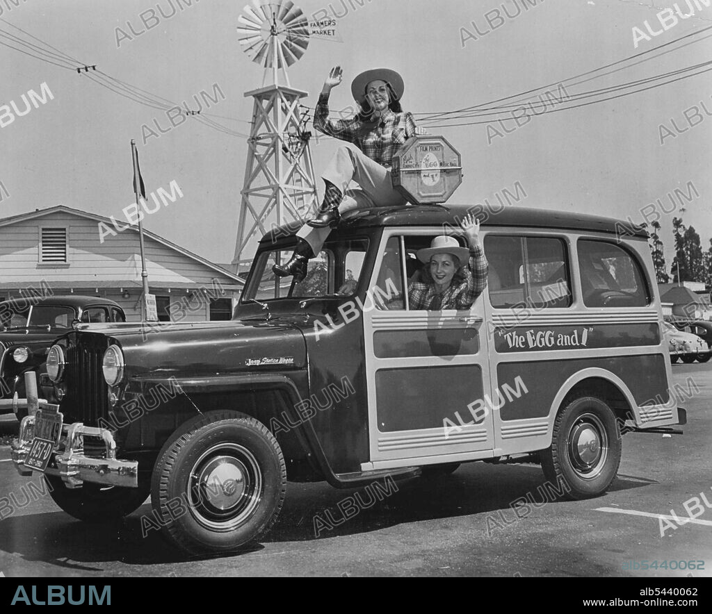 Movie starlets Judith Woodbury and Joan McTavish are pictured as they left Los Angeles' famed Farmer's Market enroute to New York City with a print of "The Egg and I." The girl featured in the movie version of the Betty MacDonald best­seller, also delivered a basket of fruit and a dozen eggs to New York's Mayor O'Dwyer--compliments of Claudette Colbert and Fred MacMurray, co-stars of "The Egg and I." February 09, 1948.