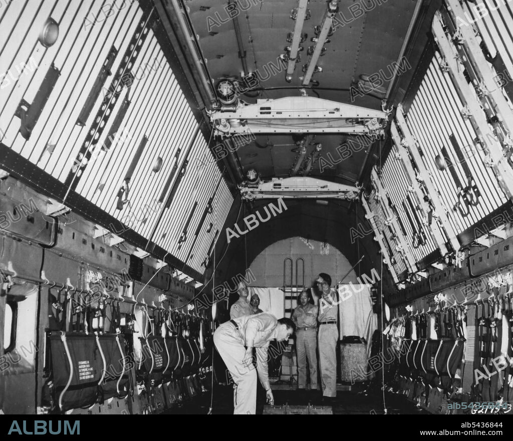 Roomy Interior The cavernous cargo hold of a U. S. Air Force C-124 "Globemaster II" demonstrates the vast cargo- carrying potential of the giant transport. Being tested under field conditions, and flying with other transports engaged in the Korean airlift by the Far East Air Forces 315th Air Division (Combat Cargo), the Globemaster will carry approximately 30 tons of cargo on a single flight in the Korean airlift, more than three times the amount carried by the C-54 Skyraaster, previously the la.