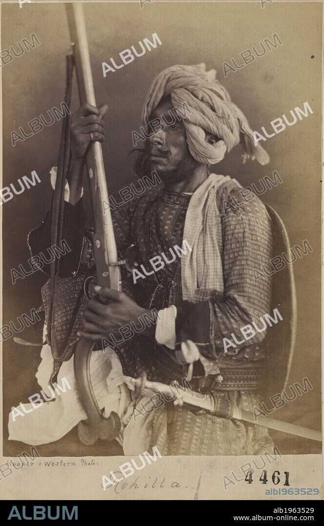 HOOPER AND WESTERN. Portrait of a Rohilla, a tribesman of the Pashtun or northern tribe. Wearing a turban. Holding a rifle. . Archaeological Survey of India Collections. India. 1860's. Photograph. Source: Photo 1000/43(4461).